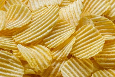 Crispy Potato Chips snack as background texture background. Stock Photos