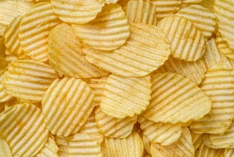 Crispy Potato Chips snack as background texture background.  Stock Photos