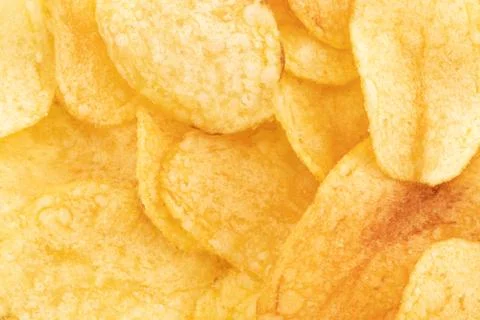 Crispy potato chips snack texture background, top view Stock Photos
