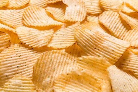 Crispy potatoes chips isolated on white background. Food background. Foto stock