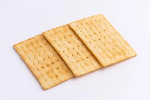 Crispy rectangular cheese crackers biscuits isolated on a white background Stock Photos