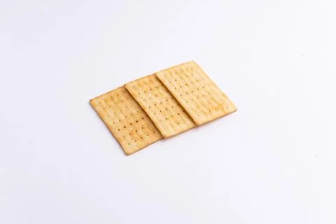 Crispy rectangular cheese crackers biscuits isolated on a white background Stock Photos