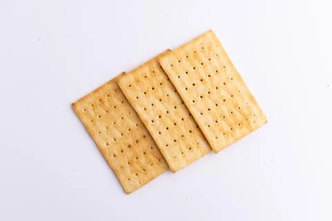 Crispy rectangular cheese crackers biscuits isolated on a white background Stock Photos