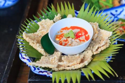 Crispy Rice Crackers with Herbed Dip of simmered preserved Soy Beans in Cocon Stock Photos