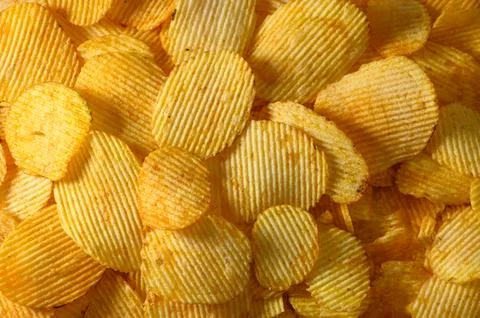 Crispy Rippled Potato Chips Texture Background Stock Photos