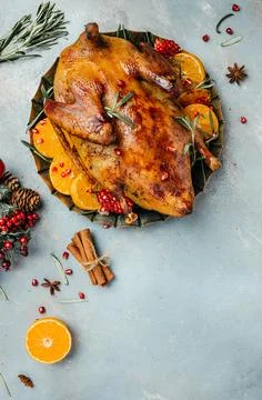Crispy roasted Barbery Duck in in roasting pan with rosemary and oranges, v.. Fotos de archivo
