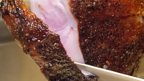 Crispy Roasted Pork Belly Being Sliced on a Cutting Board Stock-Footage 332813101