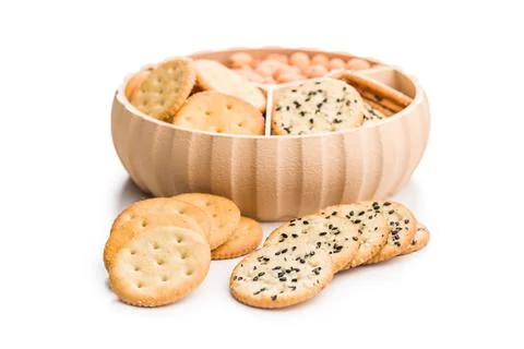 Crispy round salted crackers isolated on white background. Stock Photos