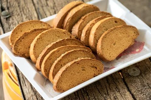 Crispy rusk, Biscuits cake rusk over wooden background , a crunchy snack in.. Stock Photos