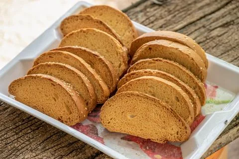 Crispy rusk, Biscuits cake rusk over wooden background , a crunchy snack in.. Stock Photos