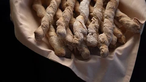 Crispy rye sticks sprinkled with flour. Rustic, laid out on a platter covered Stock Footage 159366477