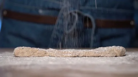 Crispy rye sticks sprinkled with flour. Sticks lie on a baking sheet, baking Stock Footage 159366524