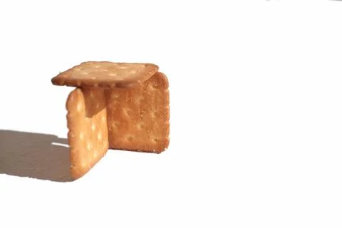 Crispy salted crackers on white background. selective focus, direct light. .. Stock Photos