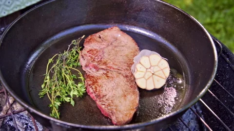 Crispy Seared Steak Cooked Over Fire With Herbs And Garlic Video stock 326022216
