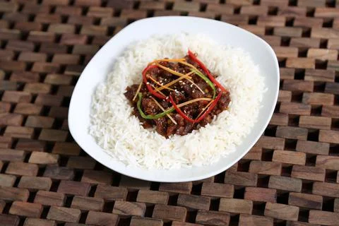 Crispy Shredded Beef rice served in a dish isolated on table side view of mid Stock Photos