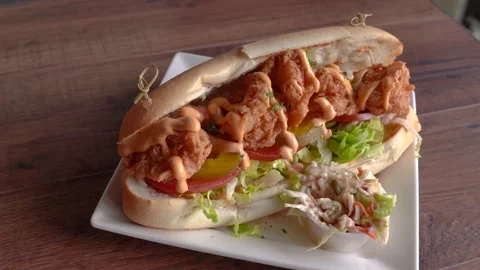 Crispy shrimp hero sandwich Stock Footage 131919341