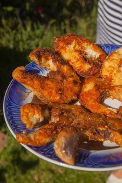 Crispy spicy fried fish steaks on a plate.. Stock Photos