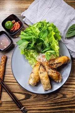 Crispy spring rolls with herbs and dip Stock Photos