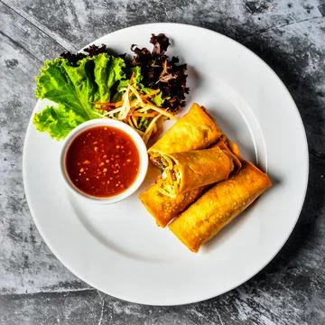 Crispy Spring Rolls with Vegetables and Dipping Sauce for Premium Appetizer.. Stock Photos