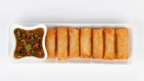 Crispy spring rolls on white dish with Sweet &amp; Sour Sauce. Stock Photos