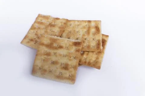 Crispy Square Crackers on White Background Stock Photos