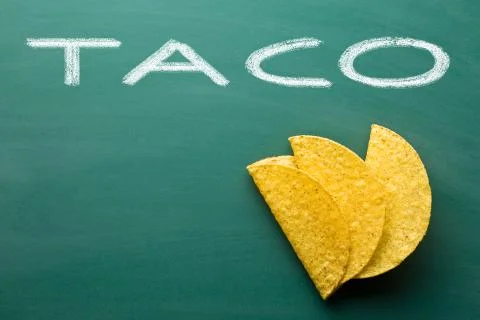 Crispy taco shells on chalkboard Foto stock
