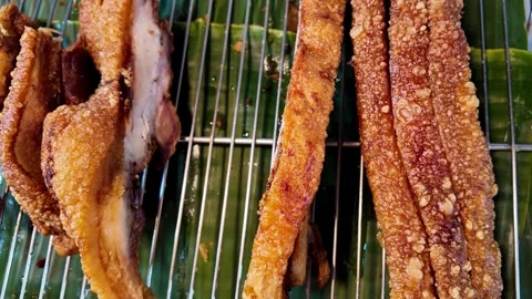 Crispy Thai Pork Belly Strips on Grill Rack at Phuket Street Food Market Видео 335580841