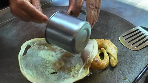 Crispy Thai Roti Pancake Being Fried on Hot Pan Video stock 325979843