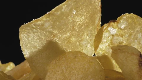 Crispy thin potato chips close-up on a dark background Video stock 135065633