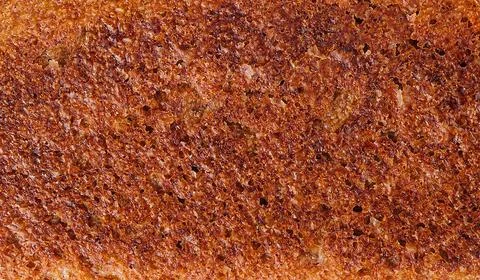 Crispy toasted bread texture close-up Stock Photos
