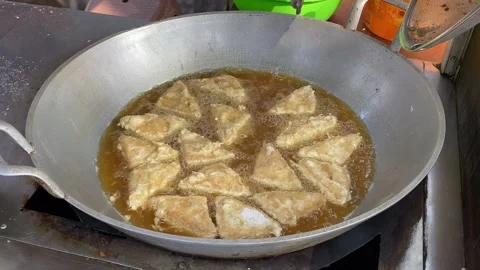 Crispy Tofu Being Fried in a Large Wok by Street Vendor Stock Footage 288055868