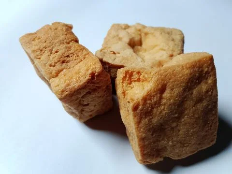 Crispy tofu on a white background. Фото