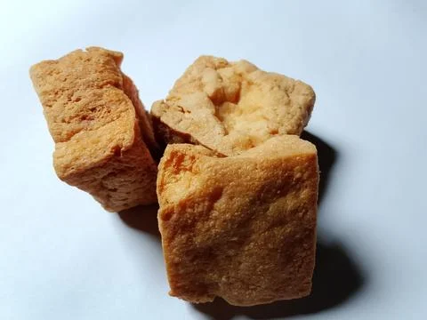Crispy tofu on a white background. Фото