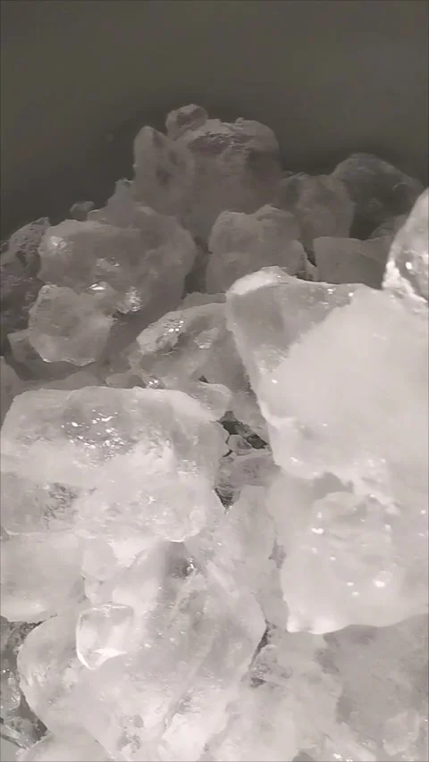 Cristal ice cubes are in a plastic basin Stock Footage 294875626