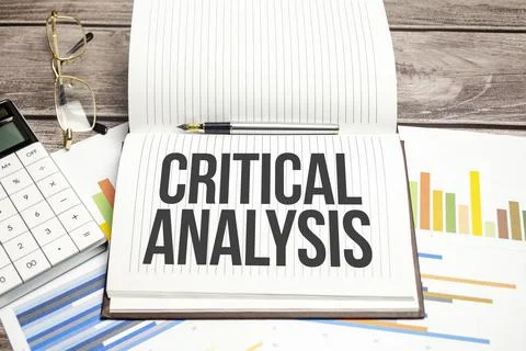 CRITICAL ANALYSIS on notepad and charts with calculator Stockfoto's