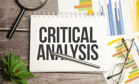 CRITICAL ANALYSIS words on notepad with magnifying glass and charts Stock Photos