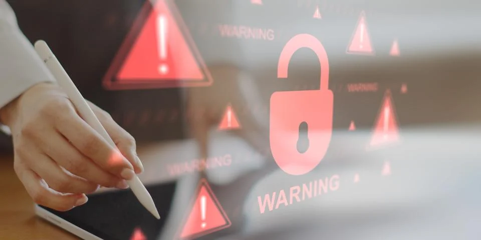 Critical Cybersecurity Breach Warning with Data Protection Risks. Stockfoto's