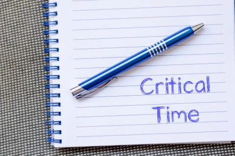 Critical time write on notebook Stock Photos