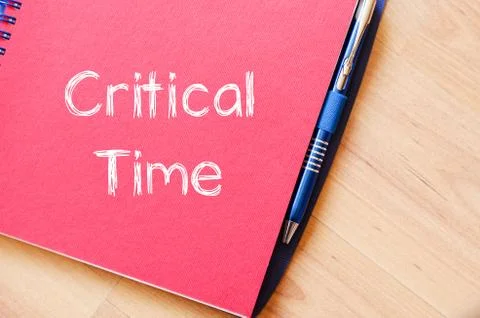 Critical time write on notebook Stock Photos