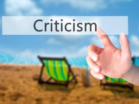 Criticism - Hand pressing a button on blurred background concept on visual sc Foto stock