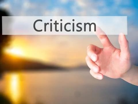Criticism - Hand pressing a button on blurred background concept on visual sc Foto stock
