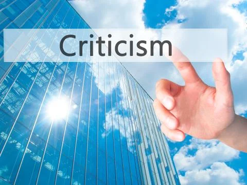 Criticism - Hand pressing a button on blurred background concept on visual sc Foto stock