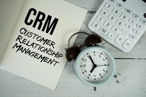 CRM Credit Risk Mitigation text on paper notebook page with alarm clock and.. Stock Photos
