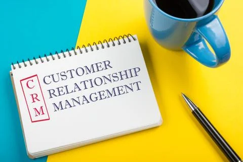 CRM customer relation management Text written on notebook page, pen and coffee Stock Photos