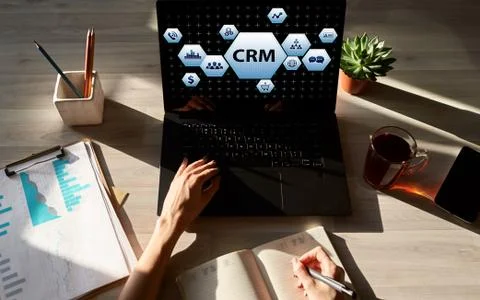CRM - customer relationship management system concept on screen. Stock Photos