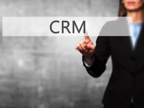 CRM - Female touching virtual button. Foto stock