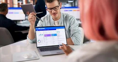 CRM Manager Explains Software Features During Team Meeting To Build Loyalty S Stock Photos