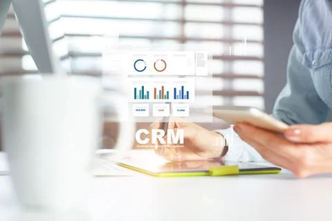 CRM software usage for customer management in a modern office on a workday Stock Photos
