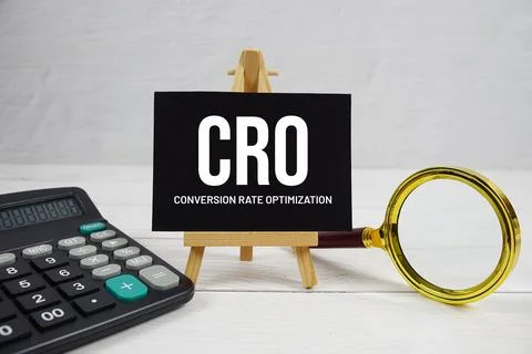 CRO abbreviation of Conversion Rate Optimization text with magnifying glass.. Stock Photos