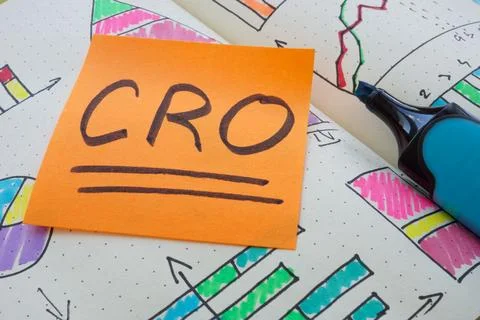 CRO Conversion Rate Optimization note in an open notebook. Stock Photos